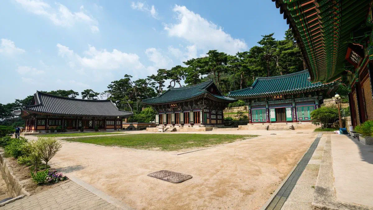 Jinkwansa temple's main hall inside Bukhansan National Park, dancheong-painted eaves and rafters