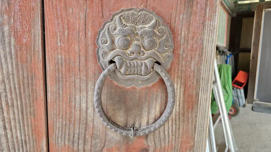 A bronze dragon-face door knocker at Bulguksa Temple