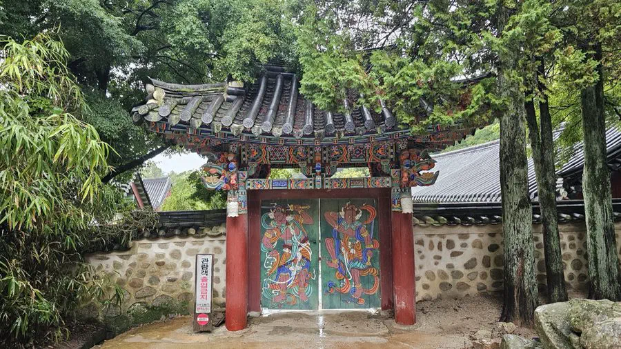 A dancheong-painted building at Bulguksa Temple with a dragon figure on the ridge