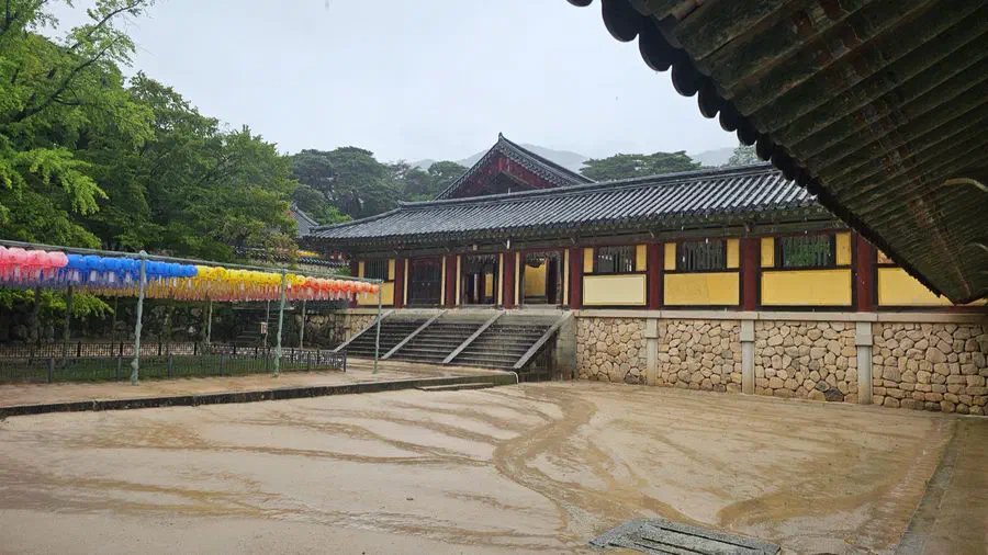 A hall at Bulguksa Temple hung with yellow lantern banners