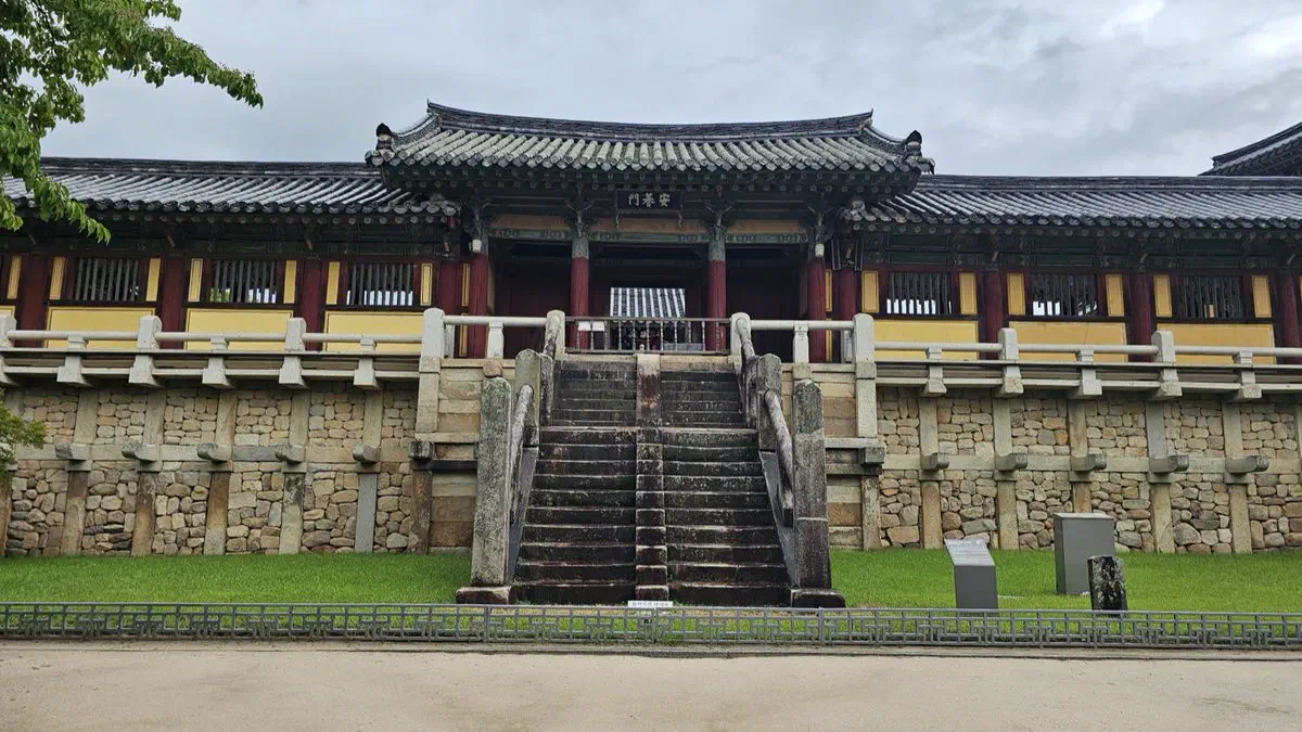 The paired stone stairways of Yeonhwagyo and Chilbogyo below Bulguksa's Anyangmun gate in Gyeongju, leading to the Geungnakjeon hall
