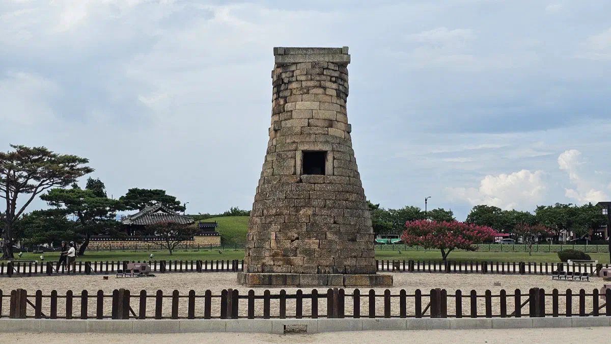 Cheomseongdae, the 7th-century stone observatory, seen from ground level with its single doorway partway up the tower