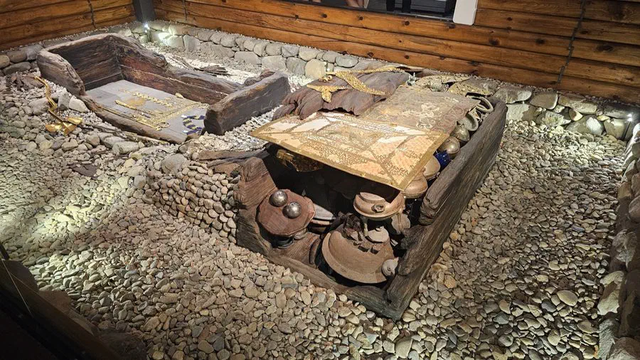A reconstructed burial display with gold artifacts inside Cheonmachong
