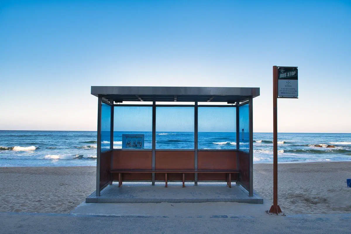 The BTS bus stop on Hyangho Beach near Jumunjin — a rebuilt replica of the set used for the You Never Walk Alone album cover, not the original