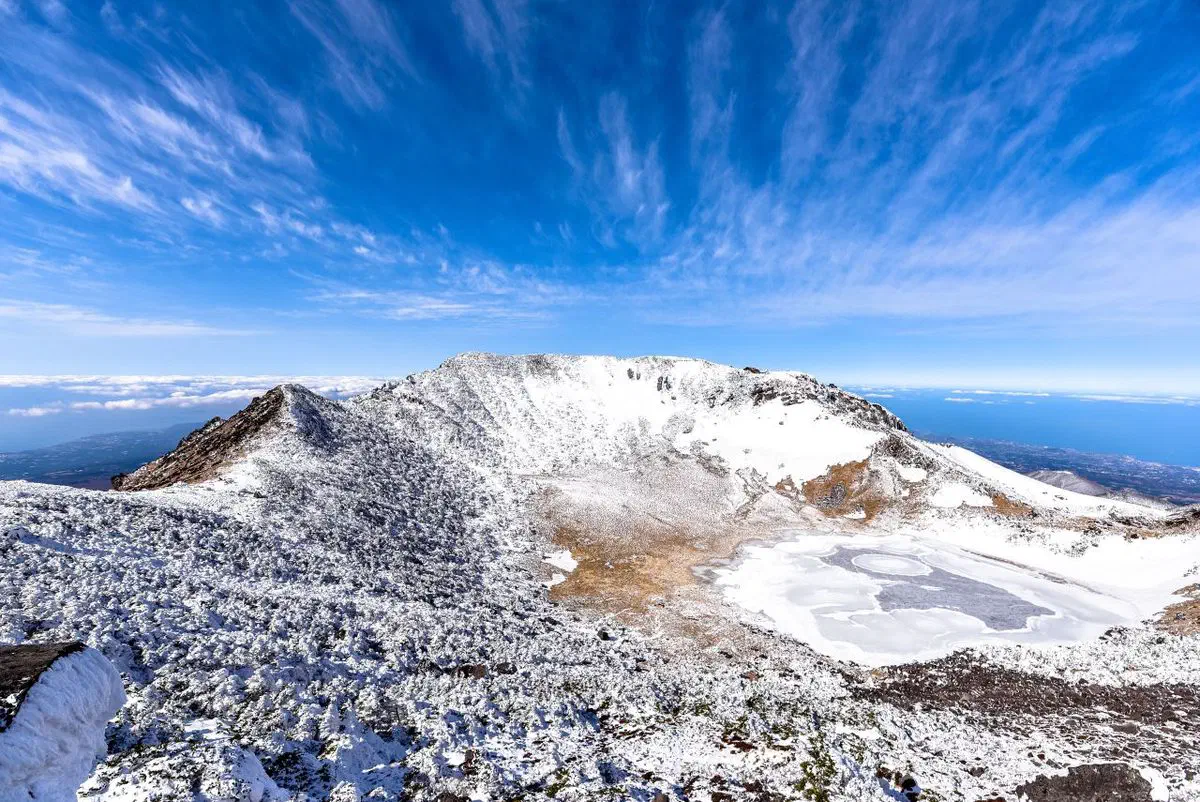 Hallasan's summit area under snow in winter, the crater rim dusted white