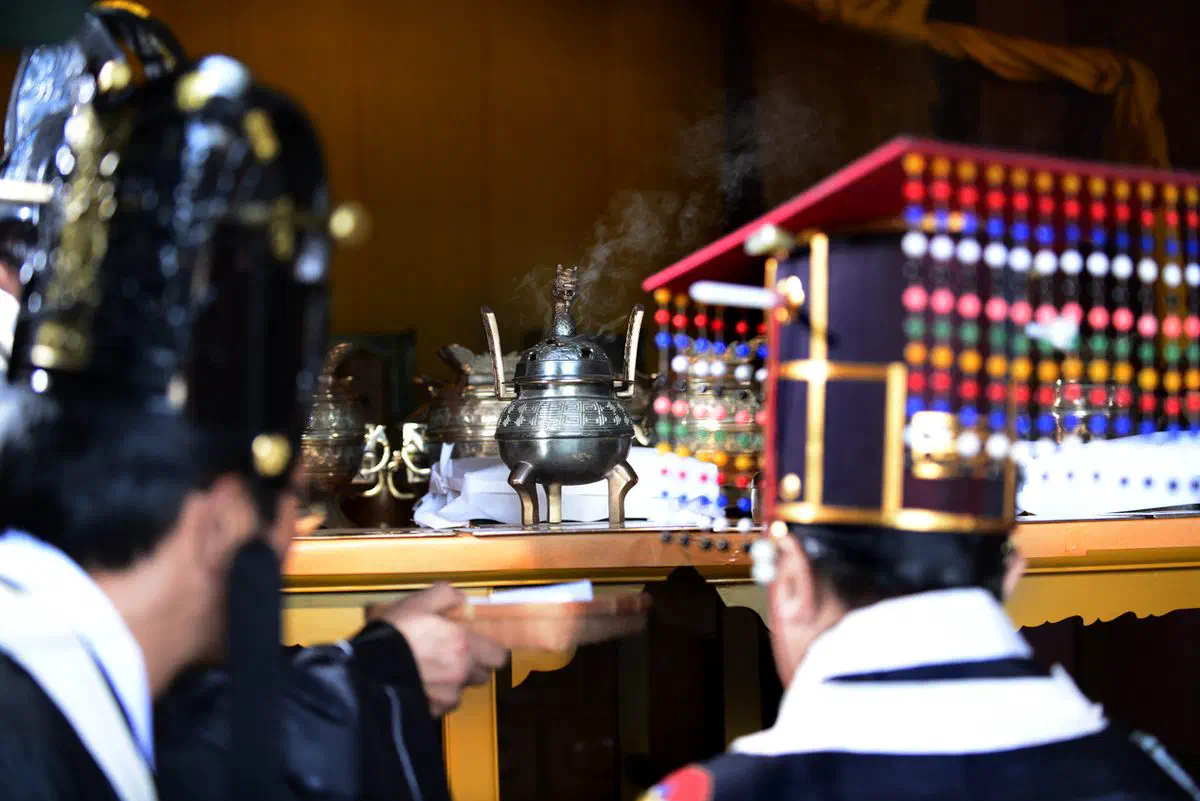 Ritual officiants in ceremonial robes performing the Jongmyo Jerye royal ancestral rite at Jongmyo Shrine in Seoul