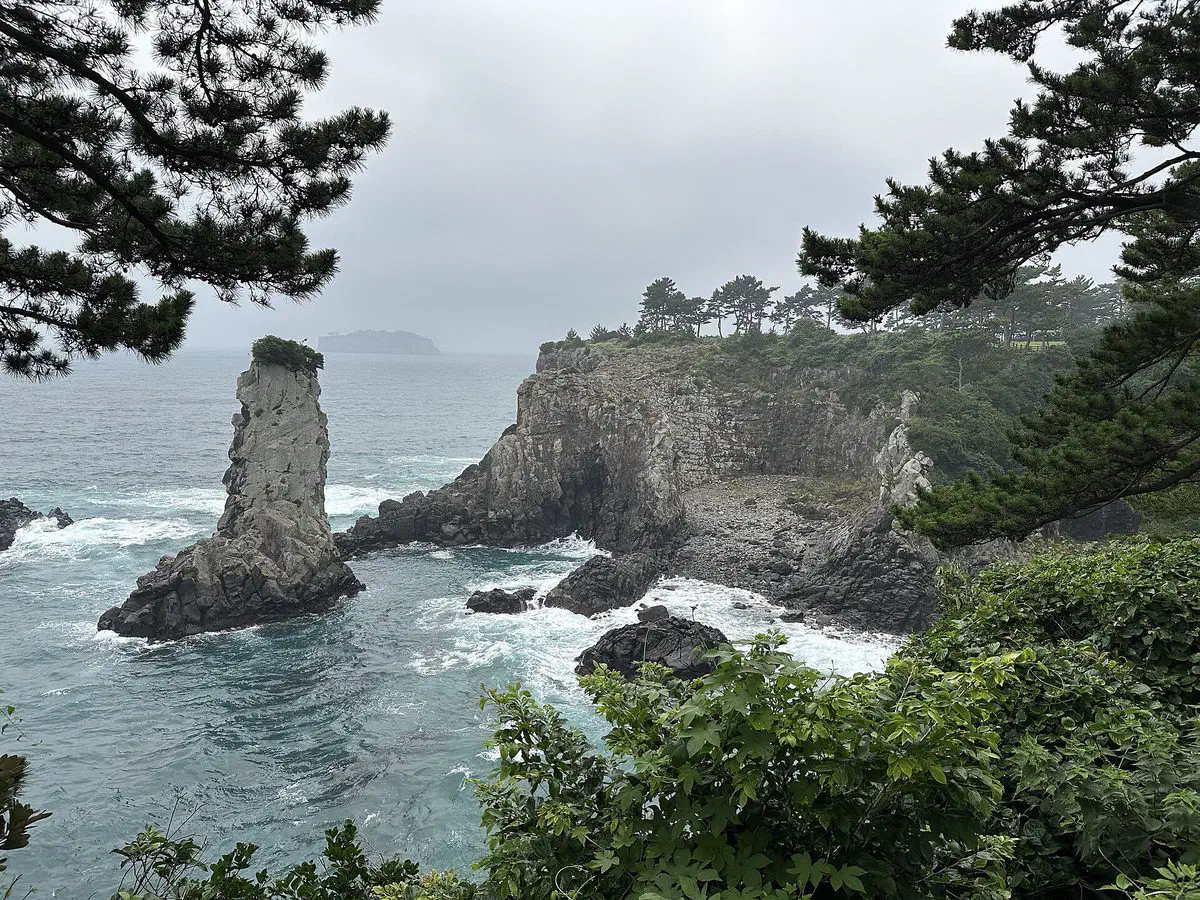 Oedolgae, a lone lava-rock sea stack rising from the coast at Seogwipo, Jeju Island
