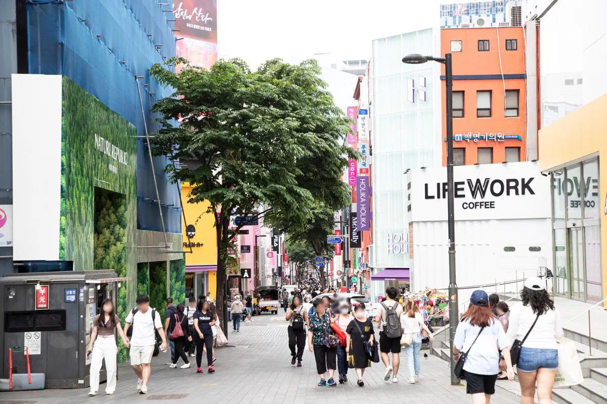A shopping street in Myeongdong, Jung-gu — the neighborhood with Seoul's highest concentration of tourist-facing optical shops