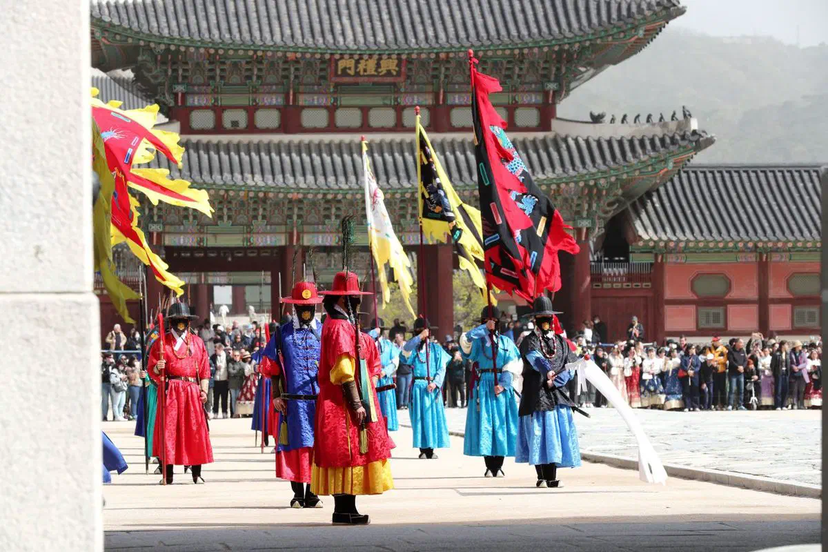 The changing of the guard ceremony at Gyeongbokgung, guards in Joseon uniform with flags and drums